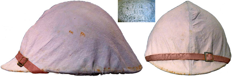 Couvre-casque réglementaire bleu clair, usagé. Couvre-casque réglementaire bleu clair, usagé.