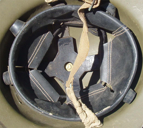 Coiffe avec tampons amortisseur ronds.