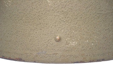 Détail d'un rivet de fixation du cerclage. Détail d'un rivet de fixation du cerclage.