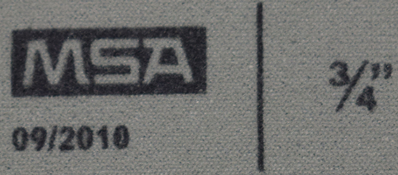 Marquage du fabricant MSA, date de fabrication et taille en pouces.