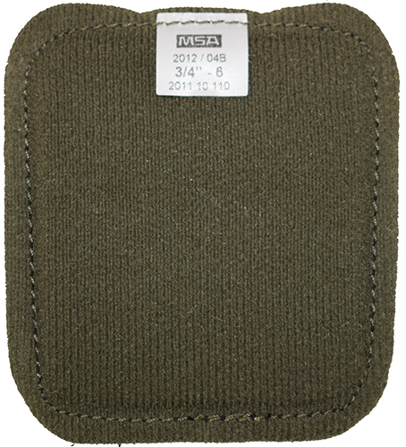 Dos vert sur coussinet noir avec étiquette.