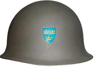 Bombe métallique avec écusson.