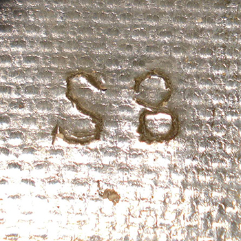 Inscription en fond de bombe. Inscription en fond de bombe.