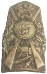 Insigne métallique modèle 28. Insigne métallique modèle 28.