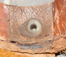 DRenfort en cuir d'un point de fixation.