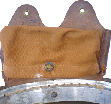 Compartiment de rembourrage, fixation par couture au cerclage.