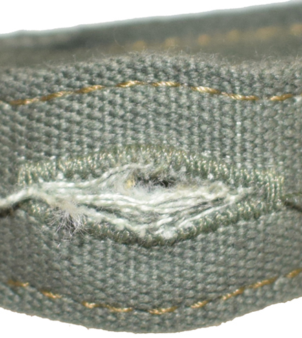 Boutonnière renforcée par couture. Boutonnière renforcée par couture.