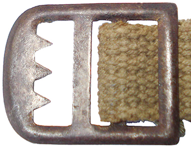 Boucle coulissante crantée.