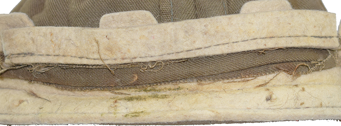 Bandeau en feutre dentellé, et doublure en feutre maintenue par une bande de toile cousue au bandeau. Bandeau en feutre dentellé, et doublure en feutre maintenue par une bande de toile cousue au bandeau.