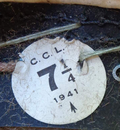 Étiquette fabricant avec taille et date de fabrication.