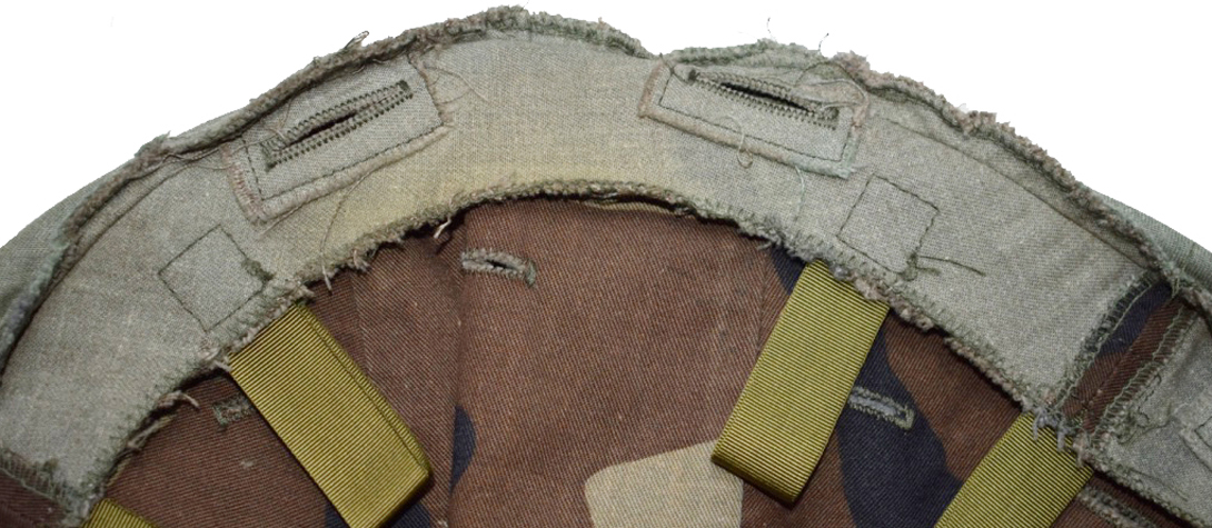 Bordure arrière avec boutonnières de passage de la bande de rétention du kit pour saut aéroportée. Bordure arrière avec boutonnières de passage de la bande de rétention du kit pour saut aéroportée.